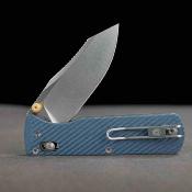 VOSA4112 — Couteau Vosteed Vombat Lame Acier 14C28N Clip Point Satinée Manche G10 Bleu Crossbar Lock - Livraison Gratuite