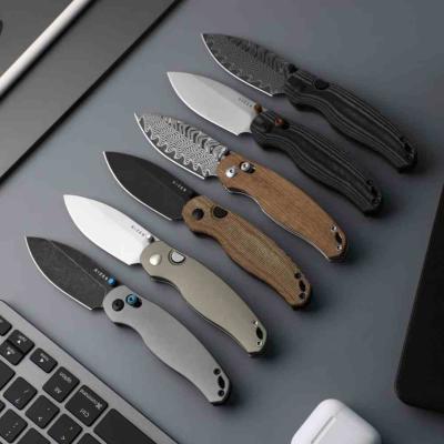 KIV3781CDA3 Kizer Phoca CD – Couteau pliant Clutch Lock Lame Acier Damas Manche Mkuruti Wood - Livraison Gratuite