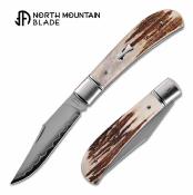 NMB2531ATL Couteau North Mountain Blade Lanny Thin | Lame Clip Point Acier SLD-Magic | Manche Corne de Cerf Slipjoint - Livraison Gratuite