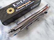 EE10B029GY Couteau ElitEdge Linerlock | Lame Drop Point Acier 440C Satin | Manche Black & Gray G10 Stainless Bolster - Livraison Gratuite