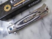 EE10B029GY Couteau ElitEdge Linerlock | Lame Drop Point Acier 440C Satin | Manche Black & Gray G10 Stainless Bolster - Livraison Gratuite